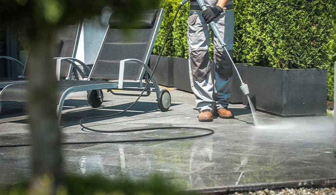 man cleaning house patios