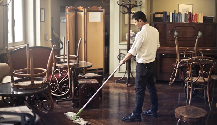 man cleaning-the hotel lounge