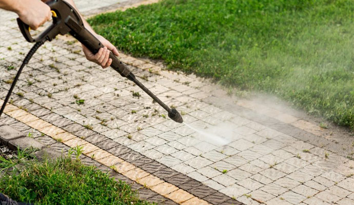 worker cleaning the sidewalk