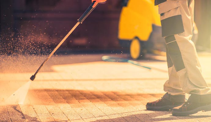 worker roadway brick cleaning